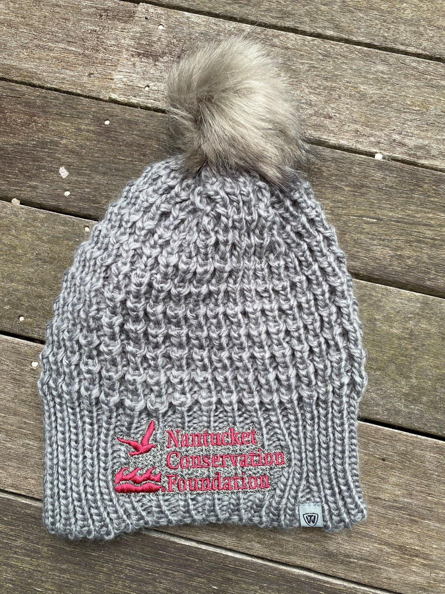 Grey Lady Winter Hat with pom-pom and Nantucket Conservation Foundation Written on the Brim